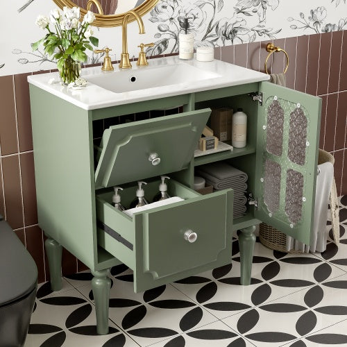 Sage green bathroom vanity with white ceramic sink, 2 drawers, and decorative glass cabinet door for vintage-inspired bathroom organization.
