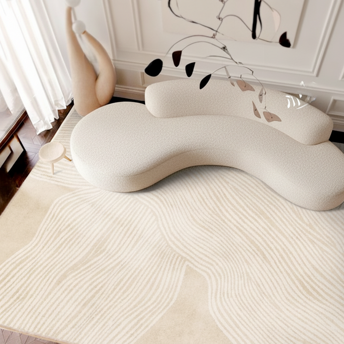 Modern cream and beige area rug with organic wavy line patterns for aesthetic living room or bedroom decor.
