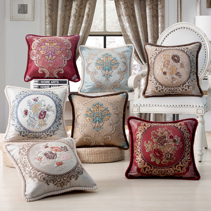 Luxury jacquard embroidered throw pillows with vintage damask and floral patterns, featuring ornate piping and pom-pom trim for elegant home decor.