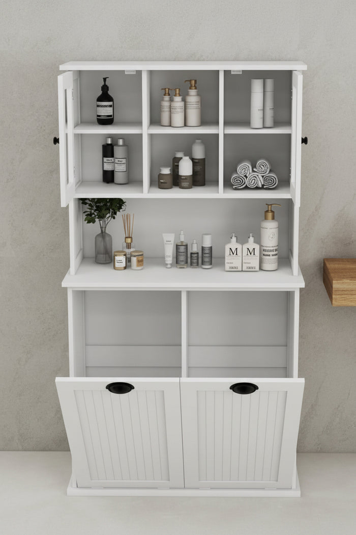 Modern white bathroom floor cabinet with tilt-out laundry hampers, open shelving, and glass doors for aesthetic home organization.